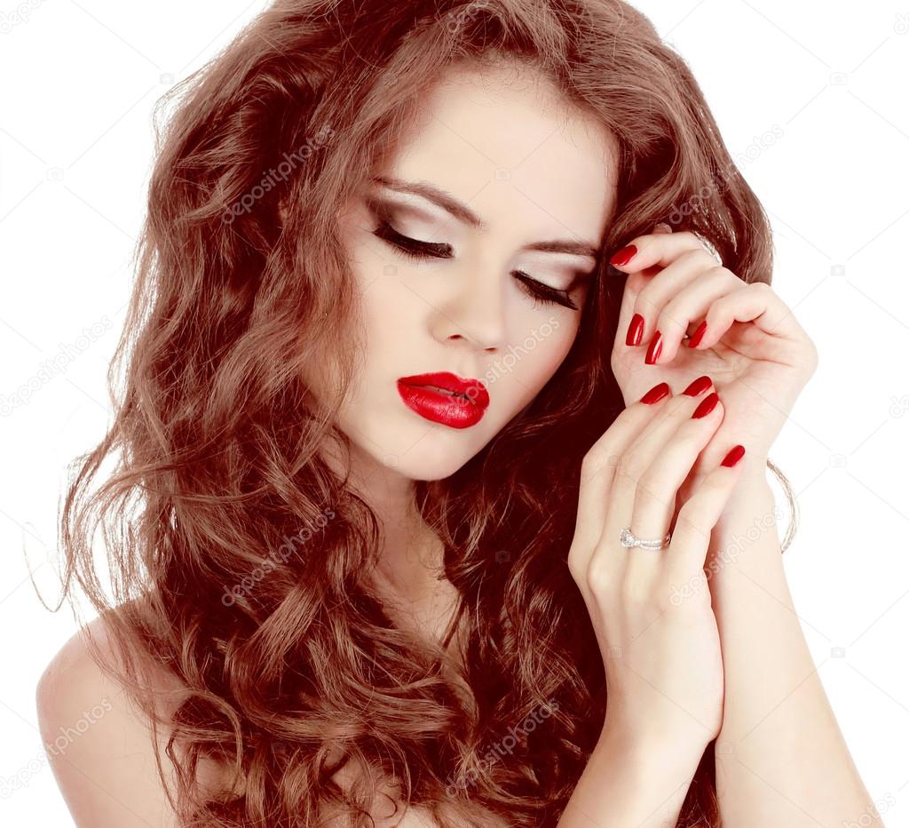 Portrait of sexy beautiful woman with red manicure nails, make-u