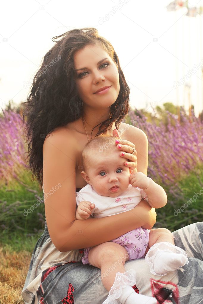 Happy Mother and baby in park, outdoors portrait