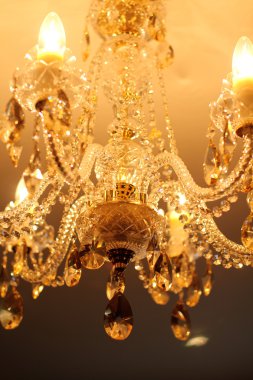 Vintage crystal chandelier in a room clipart