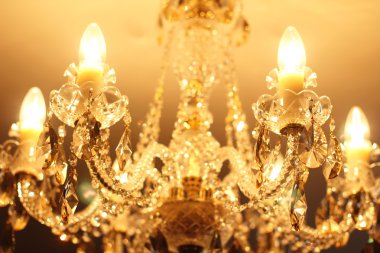Beautiful vintage crystal chandelier in a room clipart