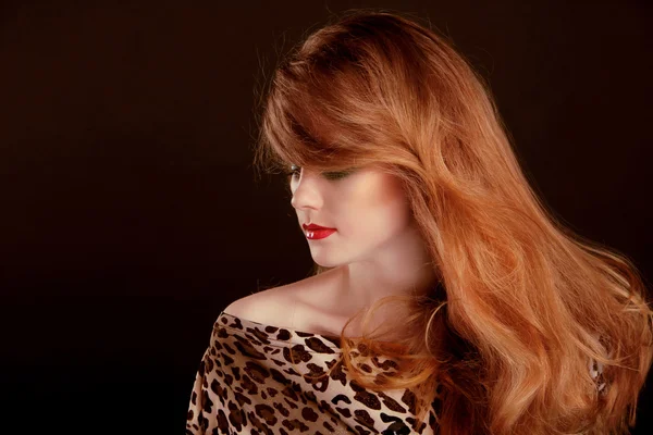 Long Red Hair. Beautiful woman portrait on black background — Stock Photo, Image