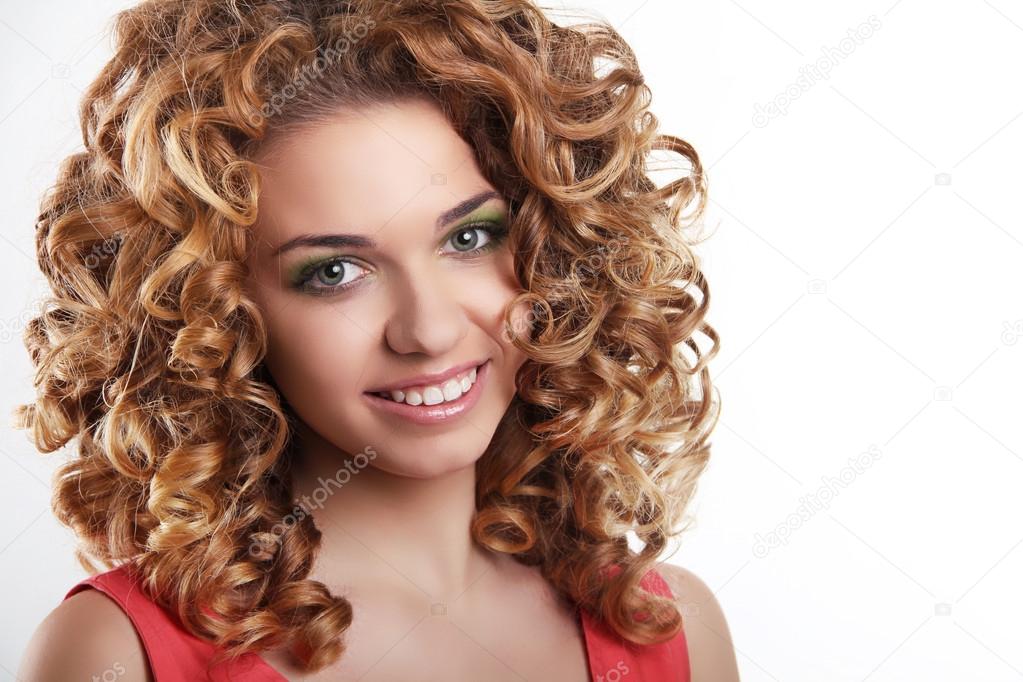 Healthy Curly Hair. Attractive smiling woman portrait on white b