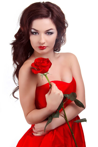 Portrait of beautiful woman with beauty long brown hair holding red rose