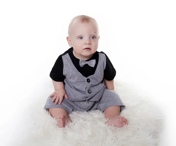 Little baby boy wearing in gentleman suit sitting over white bac — Stock Photo, Image