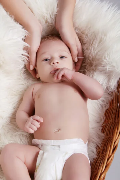 Portrait of a beautiful baby in mother hands — Stock Photo, Image