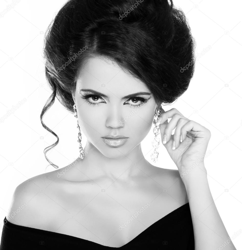 Portrait of young beautiful woman with jewelry, black and white