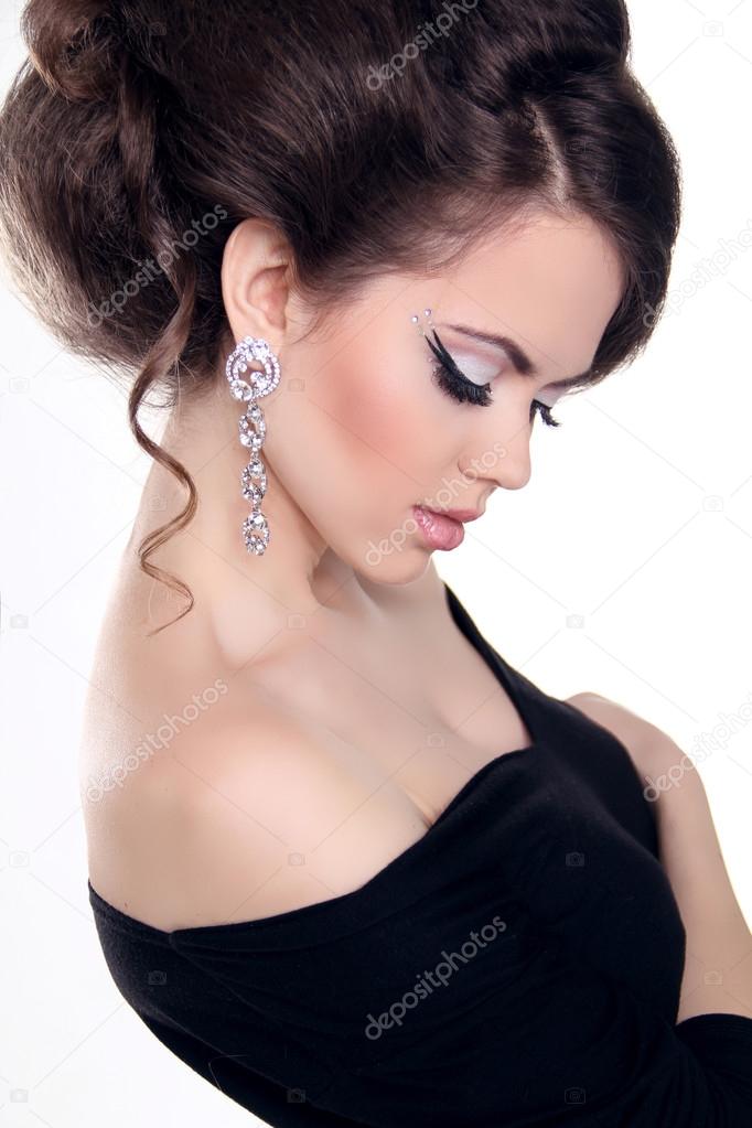 Beautiful Brunette Girl with hairstyle and make up isolated on w