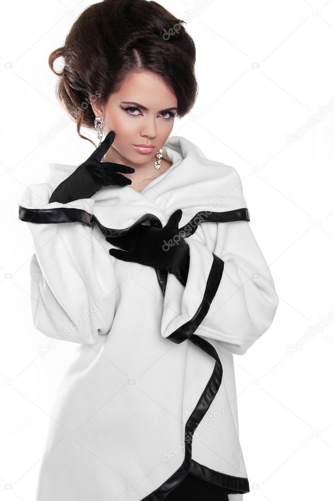 Fashion model girl with hairstyle in white coat isolated on whit