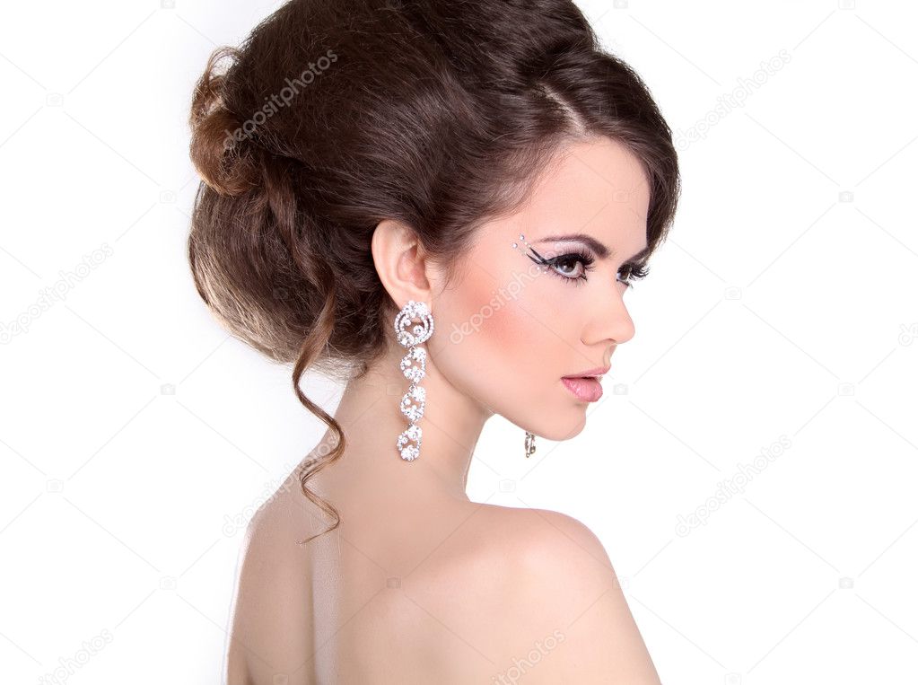 Hair style. Beautiful Brunette Girl with hairstyle and make up i