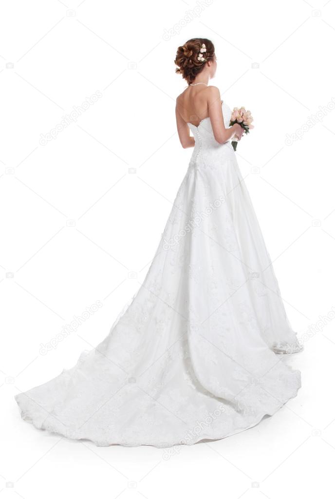 Beautiful bride in luxurious wedding dress with train isolated o