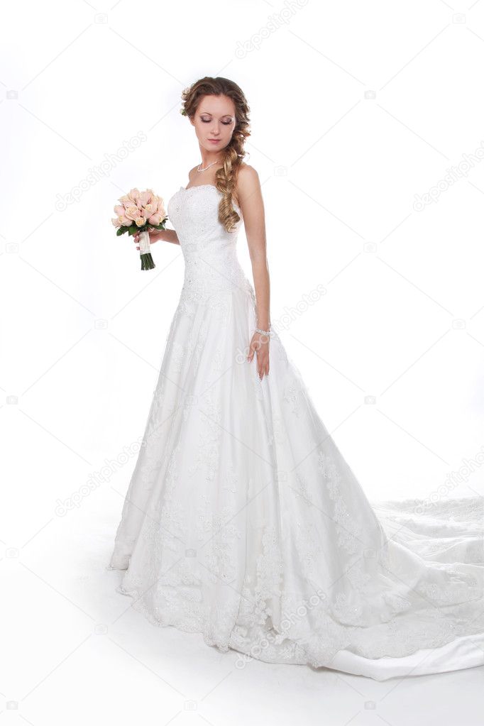Beautiful bride in luxurious wedding dress isolated on white bac