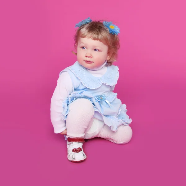 Portrait of funny cute little girl over pink background — Stock Photo, Image