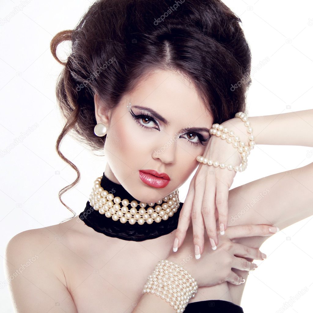 Jewelry and Hairstyle. Fashion portrait of beautiful woman with