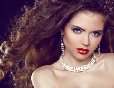 Fashion portrait of sexy woman. Red Lips. Beauty and Jewelry. clipart