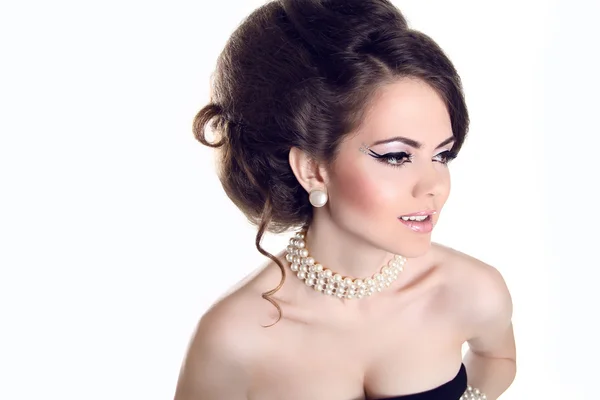 Beautiful woman with pearls and evening make-up isolated on whi — Stock Photo, Image