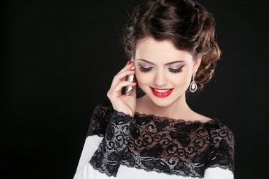 Young happy woman talking on mobile phone. Fashion Brunette Mode clipart