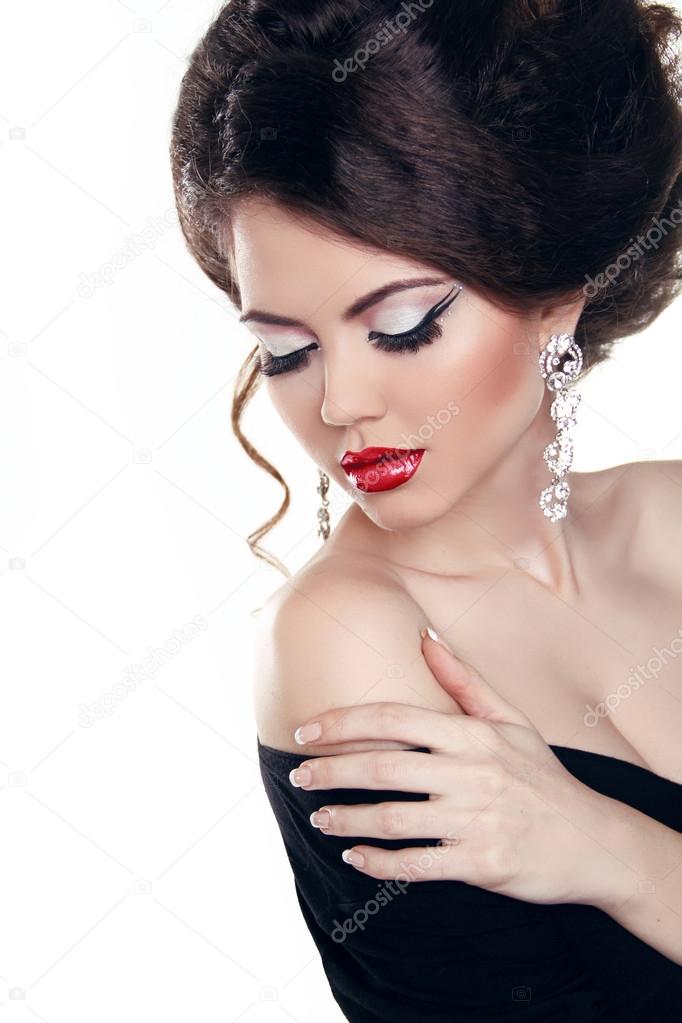 Beautiful woman with red lips, make-up. Jewelry and Beauty. Fash