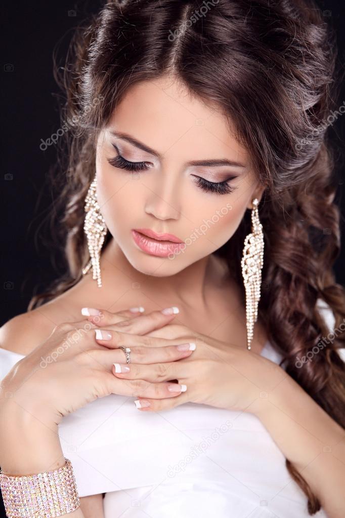 Beautiful young bride portrait in white dress. Fashion Beauty Gi