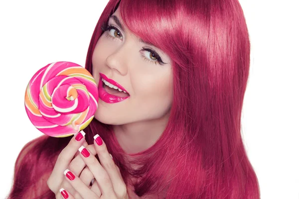 Happy smiling teen girl holding multicolored lollipop with pink — Stock Photo, Image