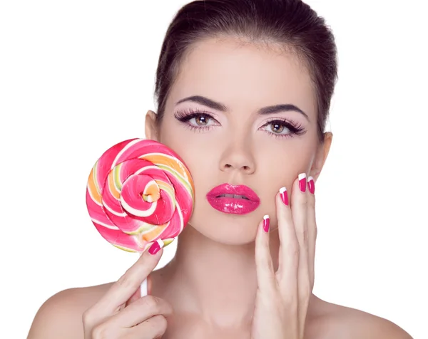 Lichte make-up. schoonheid meisje portret kleurrijke lollipop houden. p — Stockfoto