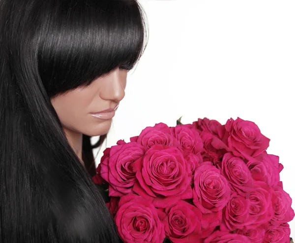 黑发女子与条纹持有分离株的玫瑰粉红色的花束 — 图库照片