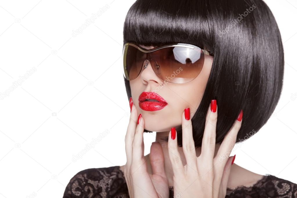 Fashion portrait of brunette woman in sunglasses showing red man