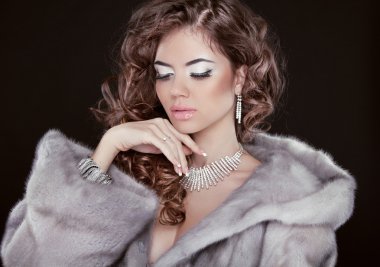 Winter beautiful girl wearing in mink fur coat with long hair st