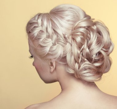 Beauty wedding hairstyle. Bride. Blond girl with curly hair styl