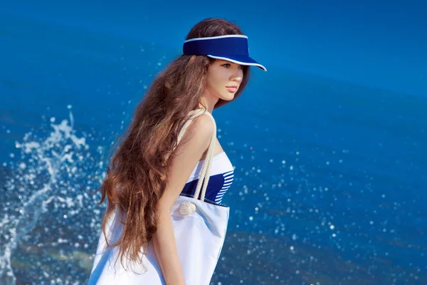 Brunette girl in swim wear posing over blue sea sky. Summer beac — Stock Photo, Image