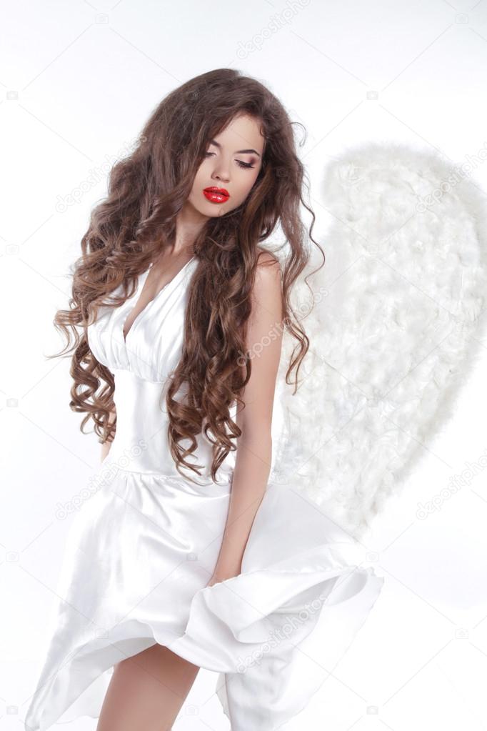 Long wavy Hair. Model Angel Girl in blowing dress with white win