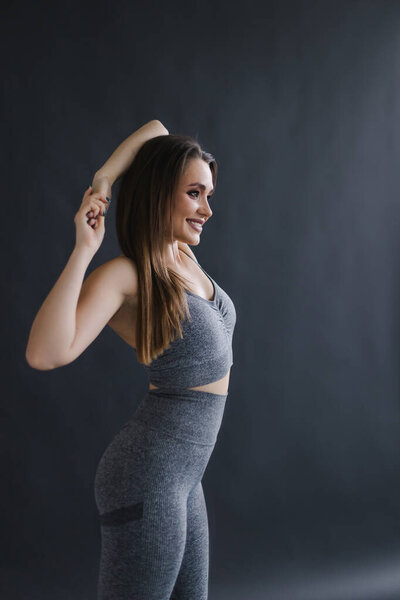 portrait of a beautiful young woman with a healthy body on  background