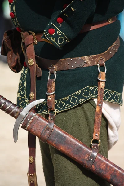 Close up of man with sword sheath