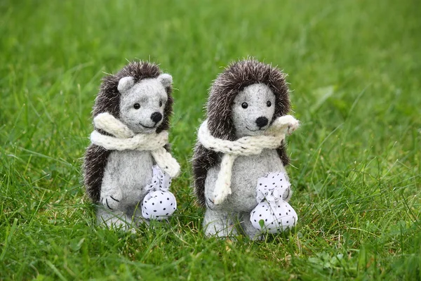 Two cute hedgehog toys in the park — Stock Photo, Image