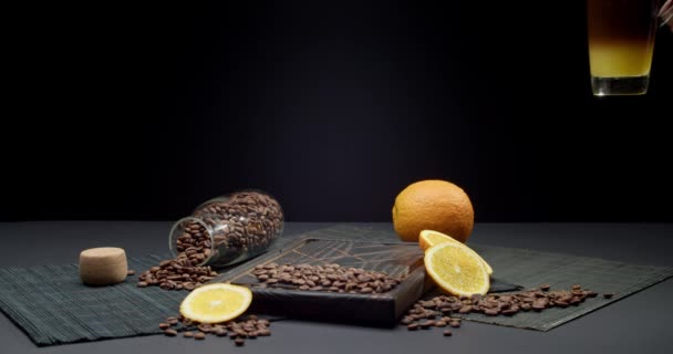 Mujer Poniendo Vaso Sabroso Café Con Jugo Naranja Mesa — Vídeos de Stock