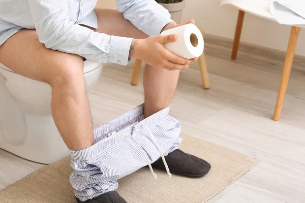 Young Man Paper Sitting Toilet Bowl Bathroom — Stock Photo, Image