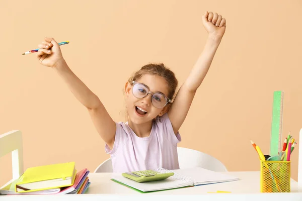 Little Girl Doing Homework Table Color Background — Stock Photo, Image