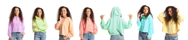 Junge Frau Trägt Stylische Kapuzenpullis Verschiedenen Farben Auf Weißem Hintergrund — Stockfoto