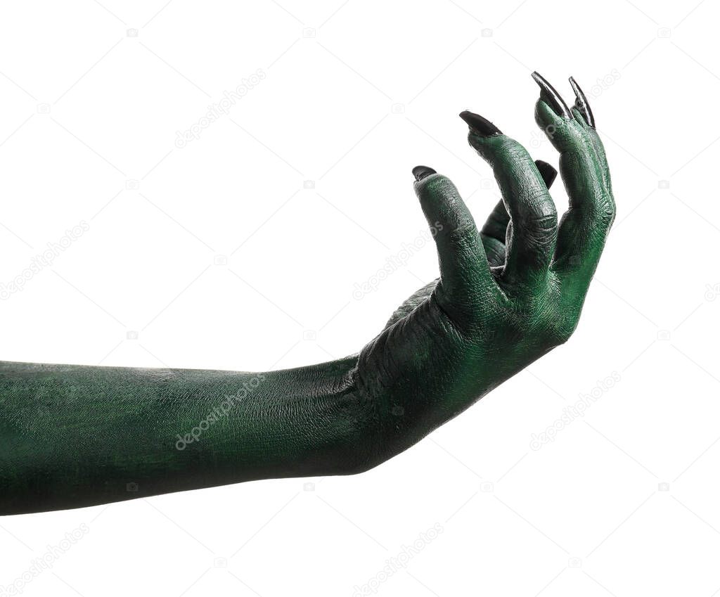 Halloween green witch's or zombie's hand isolated on white