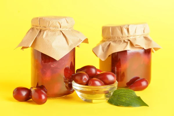 Jars Tasty Dogwood Jam Berries Yellow Background — Stock Photo, Image