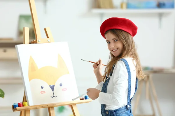 Cute little girl painting at home