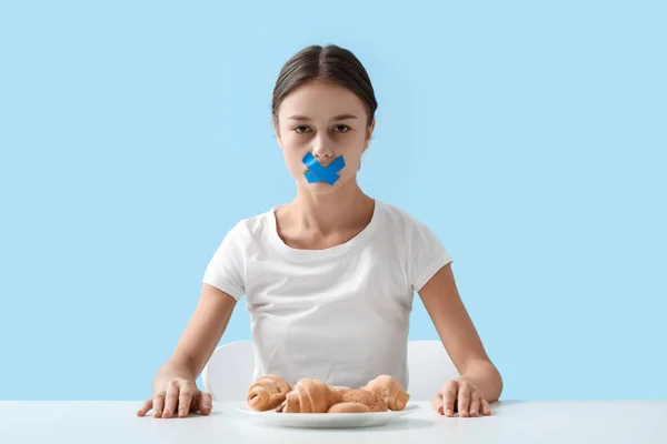 Young Woman Taped Mouth Table Color Background Anorexia Concept — Stock Photo, Image