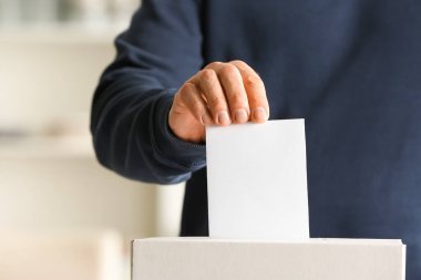 Man voting at polling station clipart