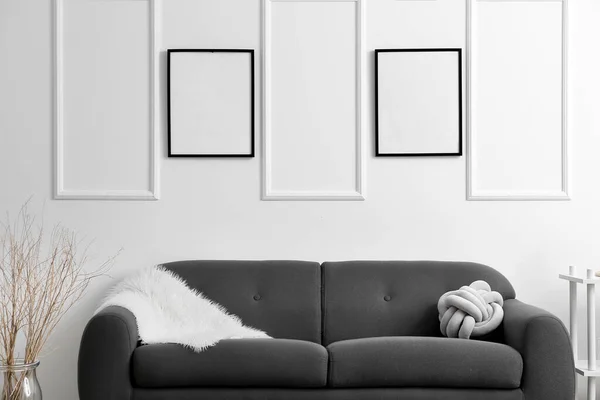Living Room Comfy Sofa Light Wall Blank Poster Frames — Stock Photo, Image