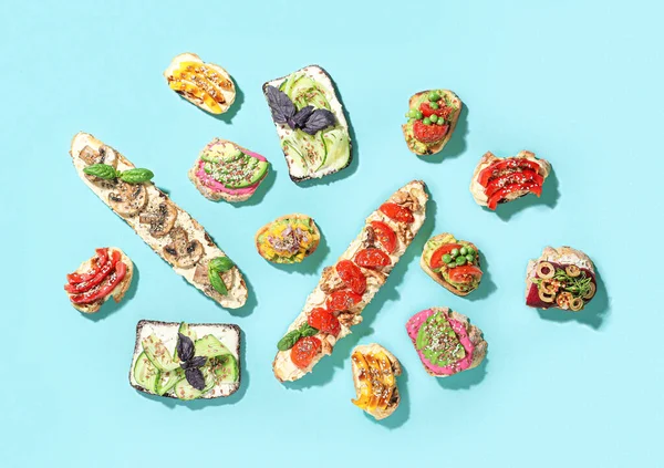 Different Tasty Vegetarian Bruschettas Color Background — Stock Photo, Image