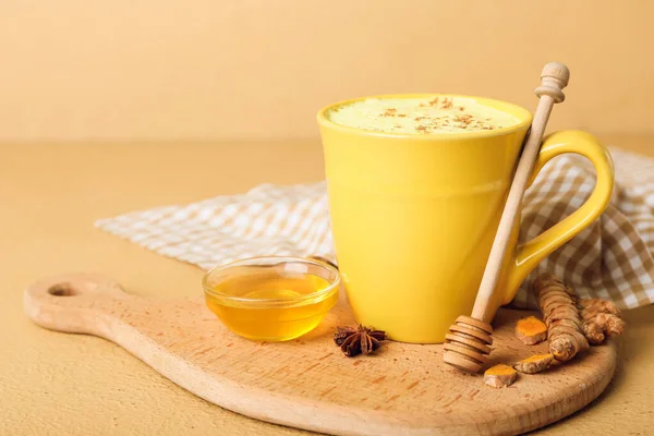 Cup Tasty Turmeric Latte Star Anise Honey Color Background — Stock Photo, Image