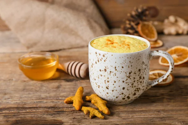 Cup Delicious Turmeric Latte Wooden Background — Stock Photo, Image
