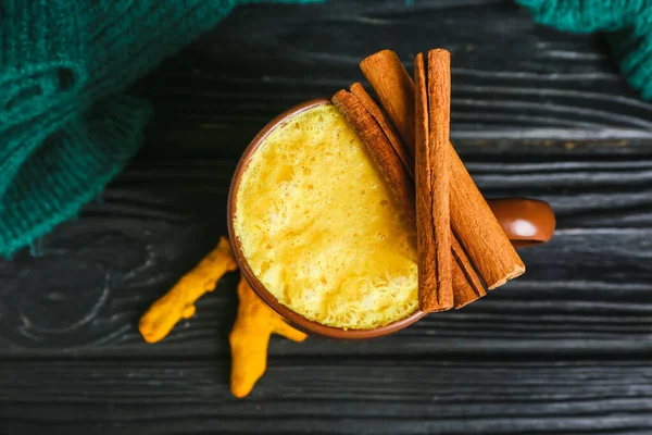 Cup Healthy Turmeric Latte Cinnamon Sweater Dark Wooden Background — Stock Photo, Image