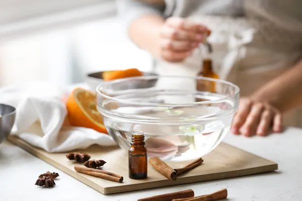 Bottle Essential Oil Spices Bowl Water Table — Stock Photo, Image