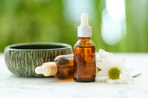 Bottles Chamomile Essential Oil Bowl Table — Stock Photo, Image