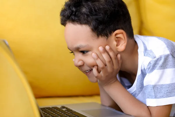 Little African American Boy Laptop Watching Cartoons While Lying Sofa — Stock Photo, Image